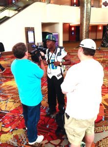 Running Back Ray-Ray McCloud talks with reporters at UA-AA Registration 