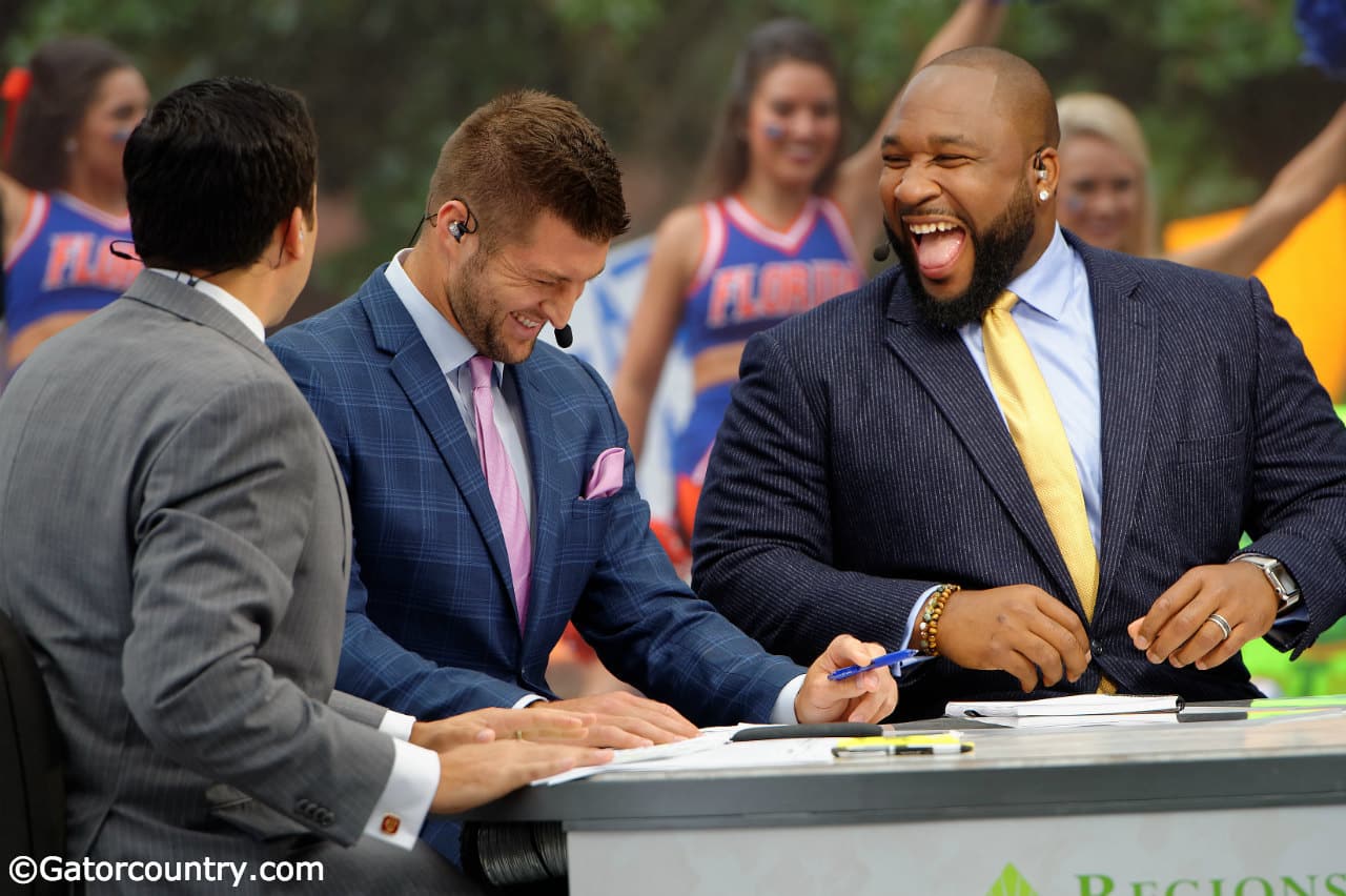 sec-network-analyst-marcus-spears-and-tim-tebow-laugh-on-set-of-sec-nation-during-a-broadcast-in-gainesville-florida-gators-football-1280×852