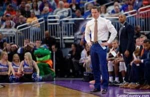 Florida Gators basketball coach Mike White looks on as the Gators play in the NCAA tournament- 1280x853