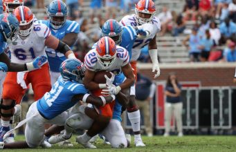 Malik Davis breaks a tackle against Ole Miss- 1186x820