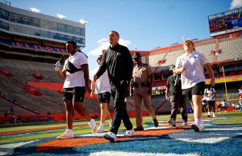 Florida Gators football head coach Billy Napier and the Gators walk into Ben Hill Griffin Stadium as they get ready for the 2023 Orange and Blue Game- 1280x853