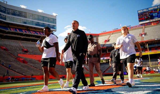 Florida Gators football head coach Billy Napier and the Gators walk into Ben Hill Griffin Stadium as they get ready for the 2023 Orange and Blue Game- 1280x853