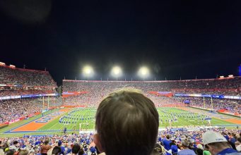 A child watches a halftime show at the Swamp, September 7, 2024